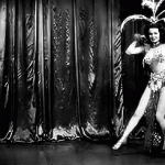 Blaze Starr is making an entrance with a lot of feathers and jewels