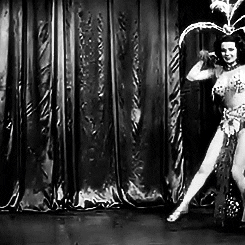 Blaze Starr is making an entrance with a lot of feathers and jewels