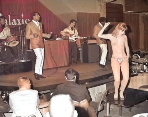 Dancing topless in front of the band