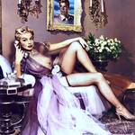 Lili St. Cyr lounging in her see through lingerie