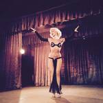 Misty Ayers in a sexy tiny black costume on stage