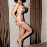 Stripper Dorian Dennis posing in fishnet stockings