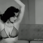 Dorian Dennis dancing in front of the couch