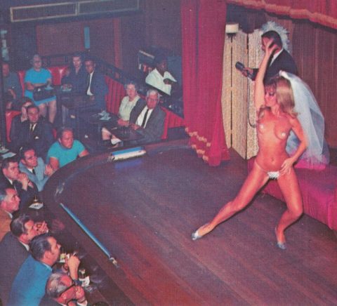 Stripper performing in front of a full audience