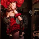A-showgirl-checks-her-costume-before-taking-the-stage-at-the-Latin-Quarter-nightclub.-Jerry-Cooke-Life-ca.-1940s