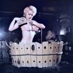 Burlesque artist in performing her clean act in a tub Burlesque-in-a-tub