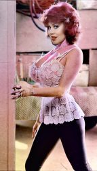 Kitten Natividad posing in a doorway Kitten Natividad